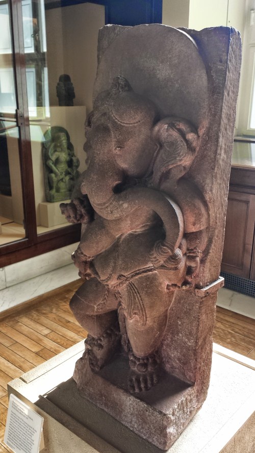 Statue of the Indian elephant diety Ganesha from ~750 AD. As the placard explains, Ganesha got his elephant's head when Shiva freaked out and cut off the human one, then promised to make amends by substituting the head of the next animal he saw.
